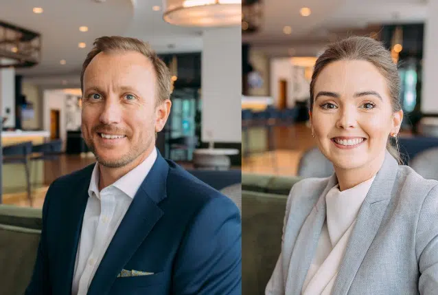 Headshot of a man and woman in suits